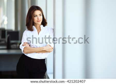 Modern business woman in the office with copy space Royalty-Free Stock Photo #421202407
