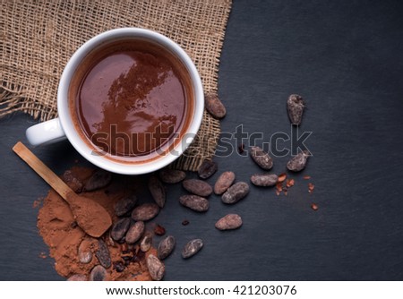 Hot chocolate on the black background, top view