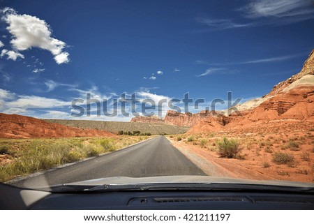 Photo of a road taken from the front seat of a car, travel concept, USA.