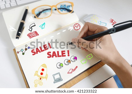 drawing icon cartoon with SALE  concept on paper in the office 