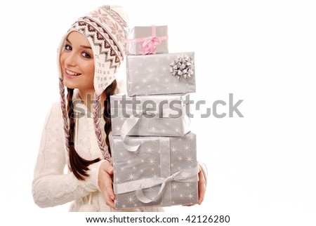 Girl holding a stack of presents on white background