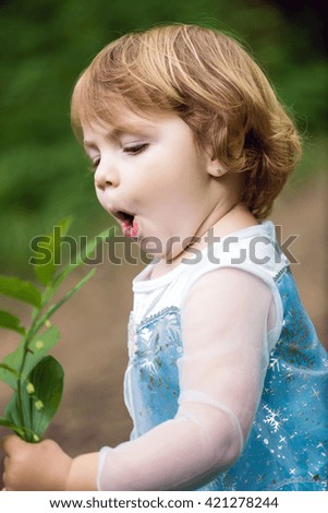 A girl holding a dandelion