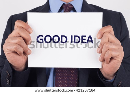Man showing paper with GOOD IDEA text