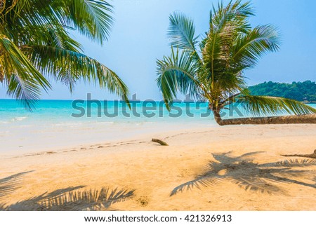 Beautiful tropical ocean or sea and sand beach on island with coconut palm tree - Boost up color Processing style