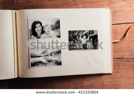 Mothers day composition. Photo album, black-and-white pictures. Mother with child. Mothers day celebration. Happy mother and son. Concept with family photos.