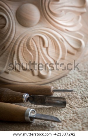 Wood processing. Joinery work. wood carving.  Carpenter wood chisel tool with carving . small depth of field. vintage toning effect. use as background