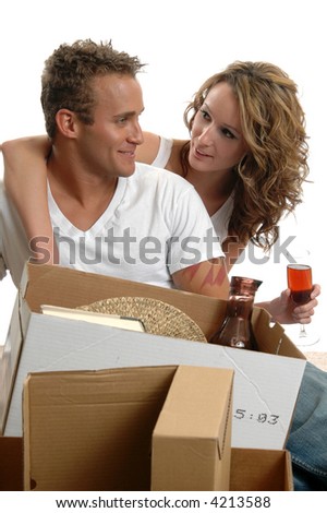 A loving young couple celebrating in their new home