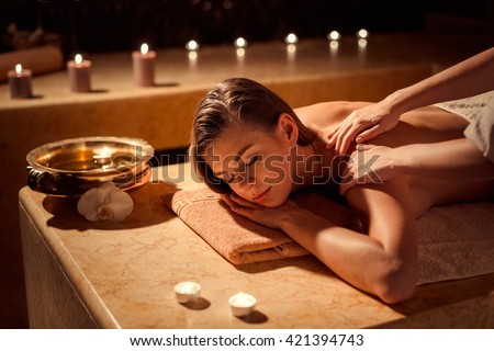 Young girl in spa massage Royalty-Free Stock Photo #421394743