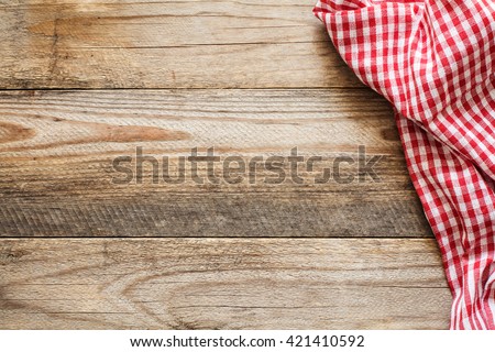 Cooking food / pizza wooden table background with red and white textile. Copy space for text