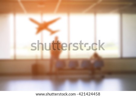 Passenger looking airplane taking off in airport