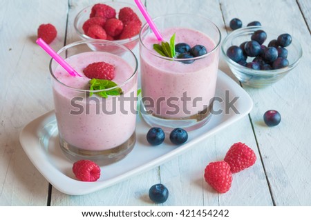 Milkshake with fresh berries: raspberries and blueberries