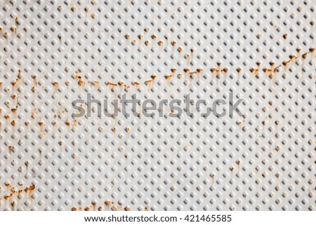 Rusty metal background with a diamond pattern