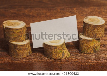 Rustic background with wooden card holder and place for text