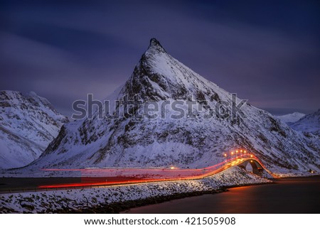 Flakstadoya bridge with light trace after passing truck in mountains, Lofoten 