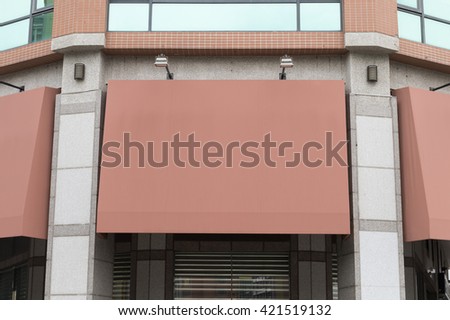 Large blank billboard on a street wall, banners with room to add your own text
