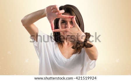 Girl focusing with her fingers