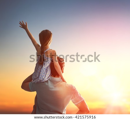 Happy loving family. Father and his daughter child girl playing and hugging outdoors. Cute little girl and daddy. Concept of Father's day. Royalty-Free Stock Photo #421575916