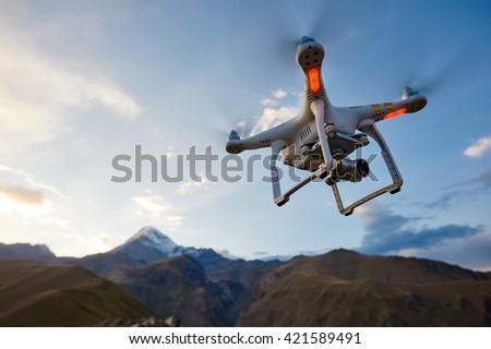 uav drone copter flying with digital camera Royalty-Free Stock Photo #421589491