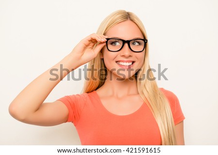 Cheerful happy smiling blonde in red shirt and glasses