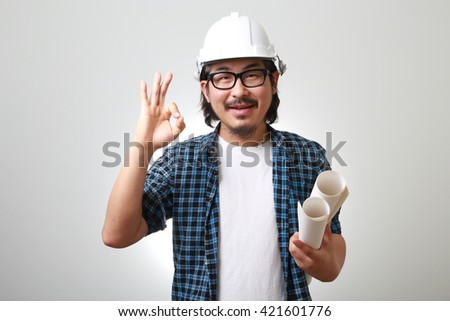 The Asian engineer showing okay sign.