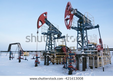 Oil industry and gas industry. Work of oil pump jack on a oil field. 