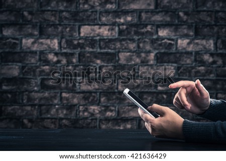 Men are operating smartphone