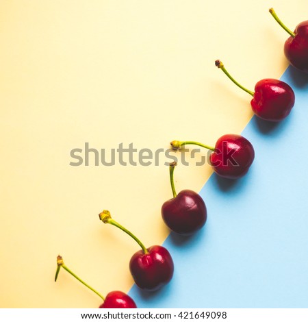 group of cherries on pastel trend background, minimal theme
