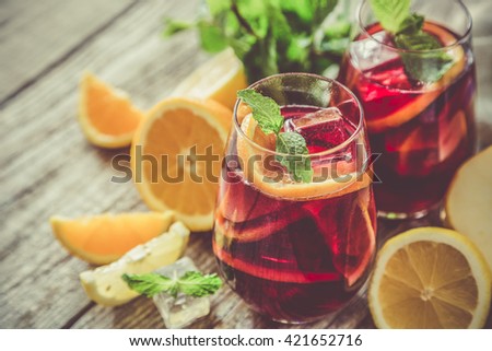 Sangria and ingredients in glasses Royalty-Free Stock Photo #421652716