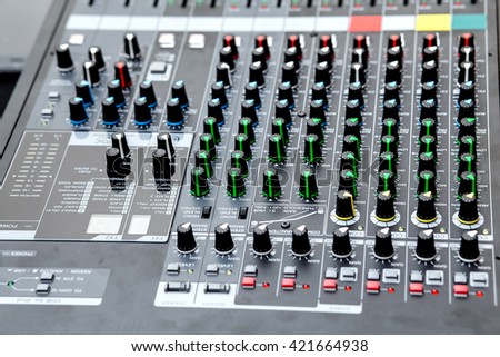 Buttons and tabs in various parts of the audio controller mixer 