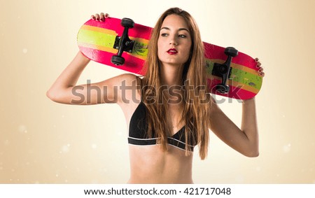 Pretty girl holding a skate