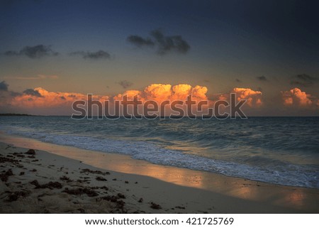 Sunset over storm cloud in the atlantic ocean