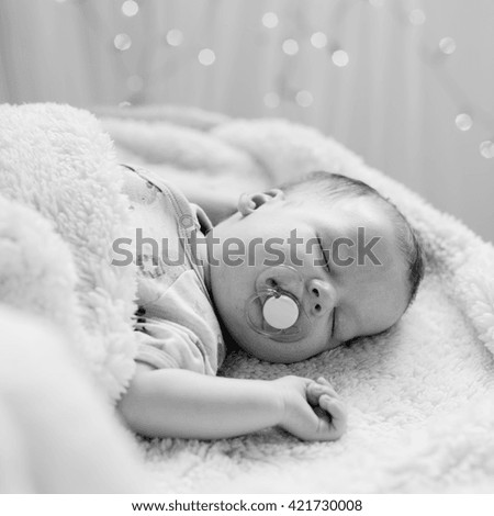 Picture of cute sleeping newborn with pacifier