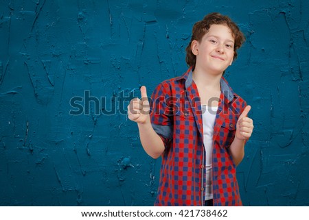 Little boy giving the thumbs-up sign