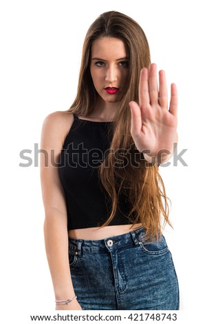 Young girl making stop sign