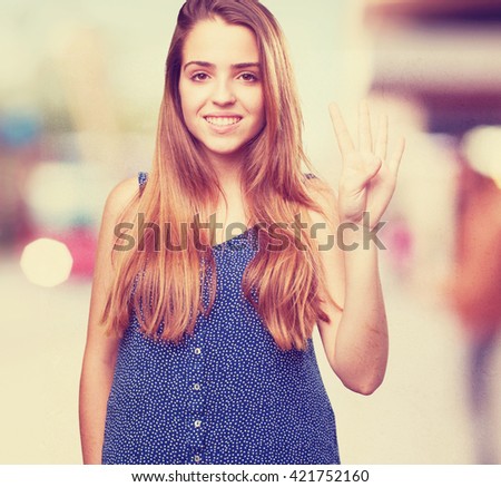 young pretty woman doing number four gesture