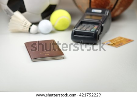 football, passport, golf ball, tennis ball, shuttlecock, basketball, credit card machines on white background.