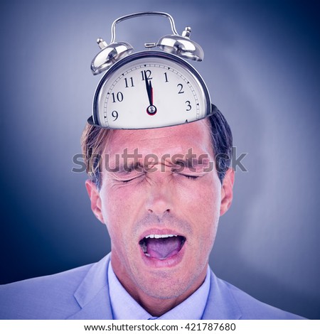 Stressed businessman getting a headache against digital image of gray wall