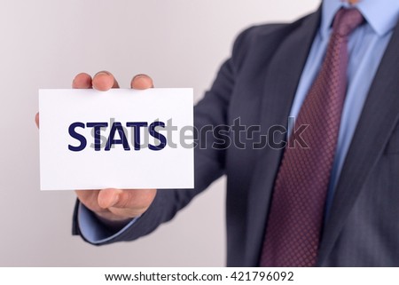 Man showing paper with STATS text