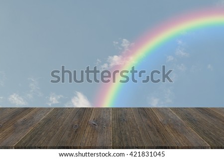 Nature cloudscape with blue sky and white cloud with Wood terrace and rainbow