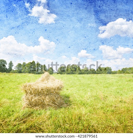 Summer landscape with haystack and blue sky- vintage style
