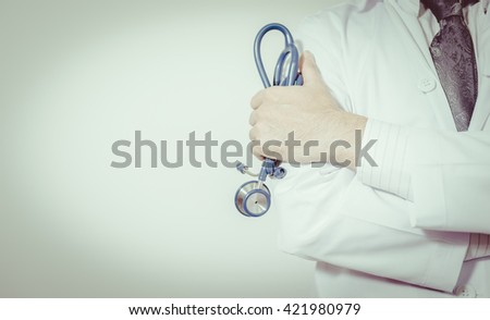 Man Doctor with a stethoscope in the hands. Doctors have a duty to treat patients. 