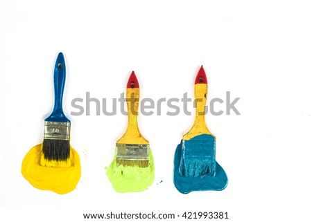 a set of paint brushes, paint of different colors