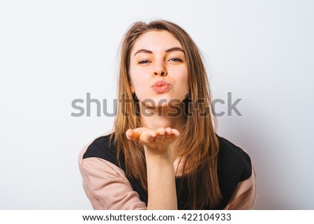 Portrait of a woman smiling and saying hello