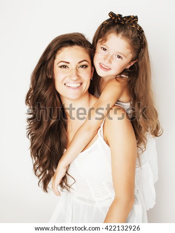 bright picture of hugging mother and daughter happy together, smiling stylish family. girls aloud