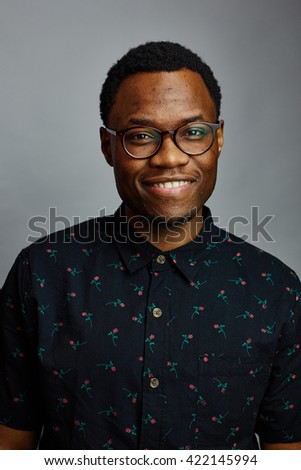 attractive young black male studio smile
