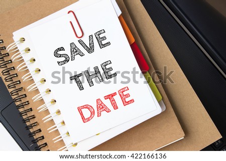 Text Save the date on white paper on the laptop computer / business concept Royalty-Free Stock Photo #422166136