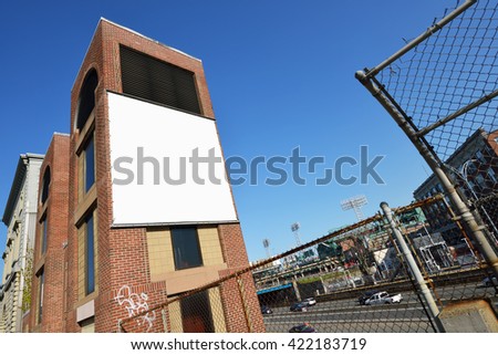 Blank billboard canvas on brick wall. Outdoor advertising in the city. 