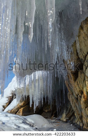 Huge icicles on a cliff.