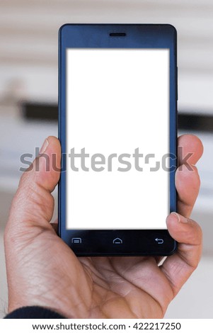 Hand holding black smartphone with blank screen (clipping path inside with copy space)