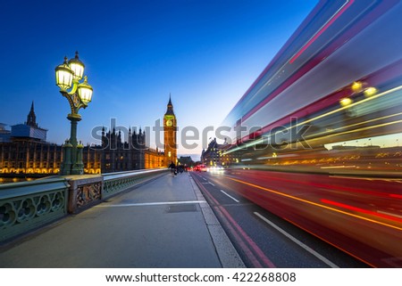 London scenery at Westminter bridge with Big Ben and blurred red bus, UK Royalty-Free Stock Photo #422268808